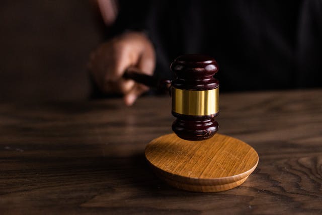 Person holding a gavel